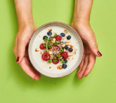 Creamy Greek yogurt with broccoli microgreens and berries